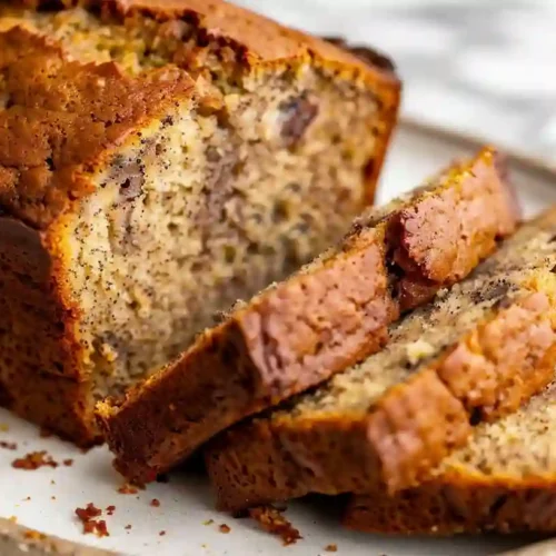 Close-up of sliced homemade banana bread loaf with moist texture and golden crust